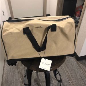 Tan Calvin Klein duffle bag